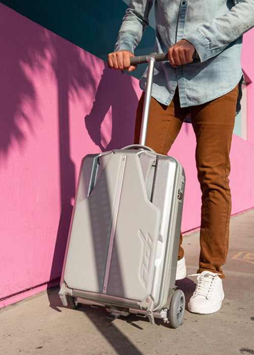 Silver Scooter with Suitcase