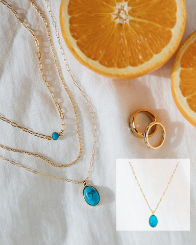 tiny turquoise circle charm on thin gold chain, simple gold chain, and bigger oval turquoise charm on the longest gold chain necklace