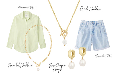 Gold jewelry with pearl details paired with button down shirt and pleated jean shorts