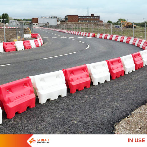 Water-filled barriers Concrete barriers Road works Construction equipment Management projects Maintenance Safety cones Temporary lights UK Durability Cost Weight Storage Ease of use Temporary barriers Permanent barriers Flexibility Impact resistance Lifespan Manpower Street Solutions UK