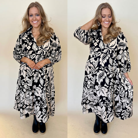 black and ivory floral plus size dress with collar and button up front. paired with black boots