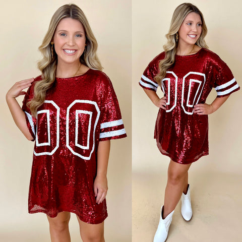 burgundy sequin "jersey" dress with number "00" on front paired with white cowboy boots