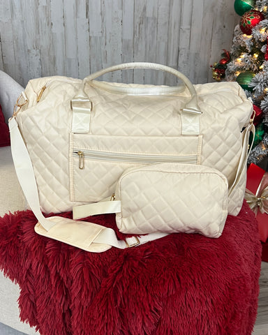 cream quilted duffel bag