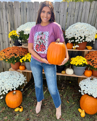purple colorful stacked pumpkins graphic tshirt with jeans and boots