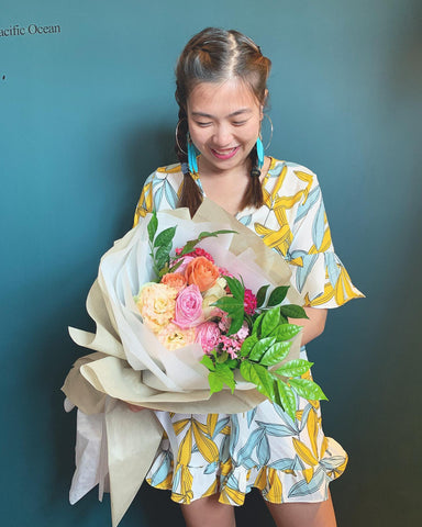 Happy girl receiving a flower with a radiant smile