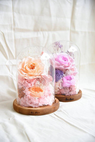 Pink and purple preserved flower domes