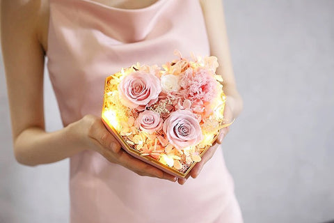 Girl receives a heart-shaped flower bouquet for a heartfelt moment