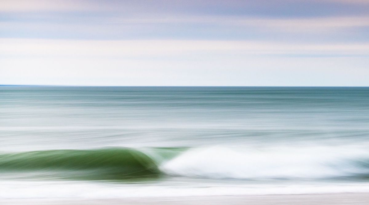 Wave in motion, photography of a wave with pastel colors by Rhode Island photographer Cate Brown