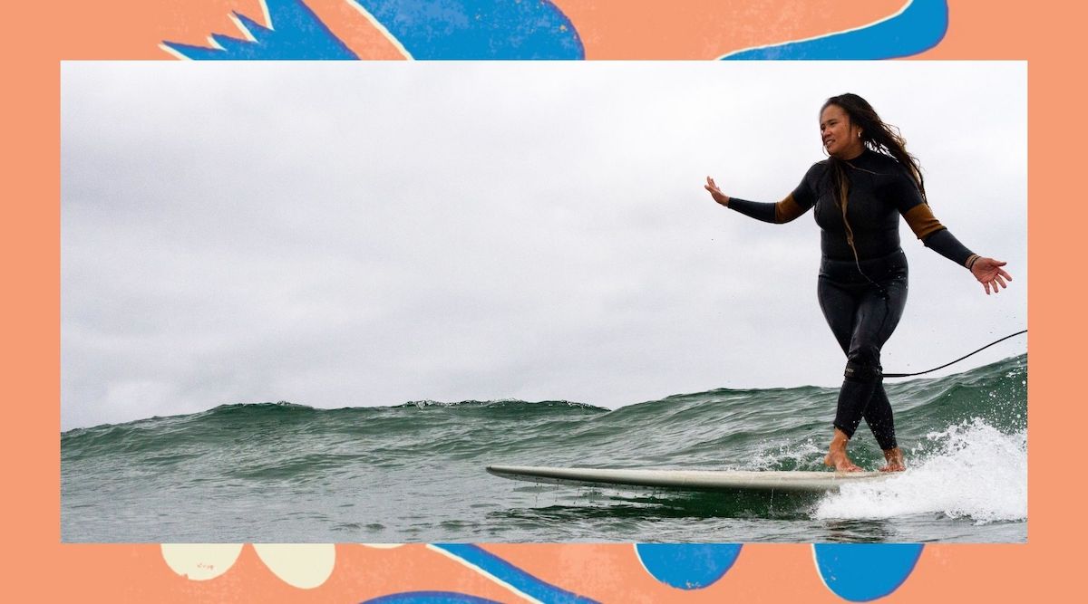 Janina Casanova surf artist riding her longboard on a green wave