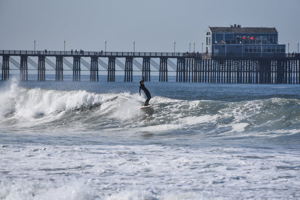 Deana hand up surfing oceanside her waves