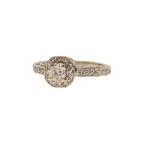 Old European cut diamond ring with halo. Set in 18k white gold, it features a .33ct center diamond with H color and VS2 clarity, surrounded by .25ctw in a diamond halo and accent stones.