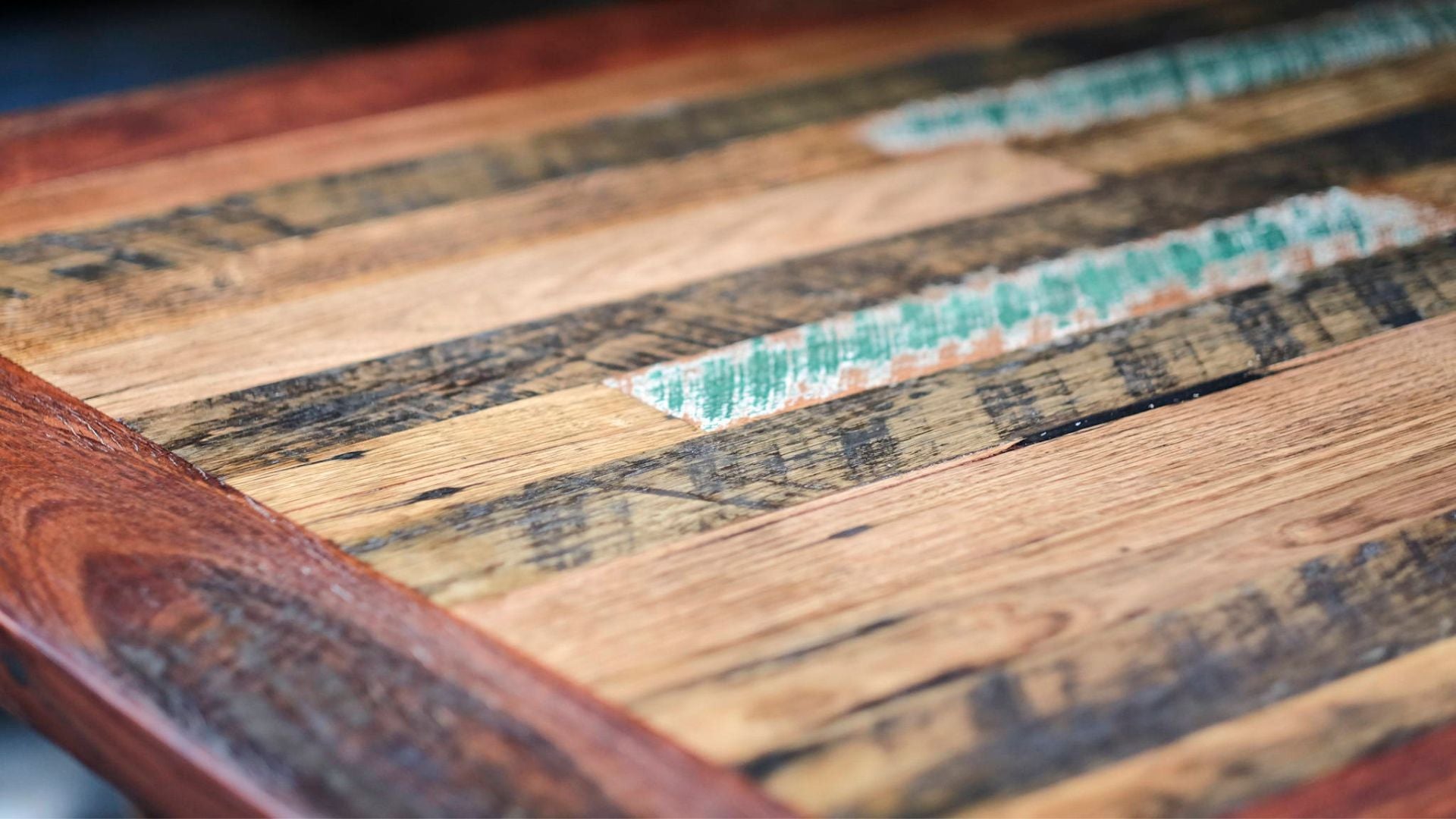 A close up of a recycled timber tabletop 