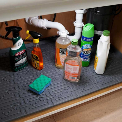 Cleaning products stored under sink on an Xtrememat