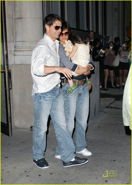 Tom Cruise wearing baggy light wash jeans