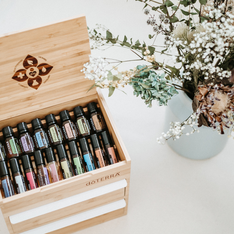 Wooden box displaying essential oils