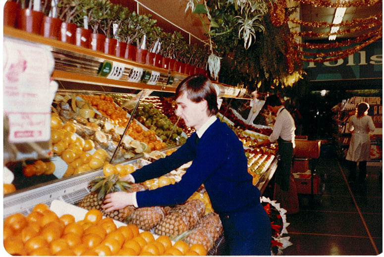 Andrzej Stacking Fruit at Safeway