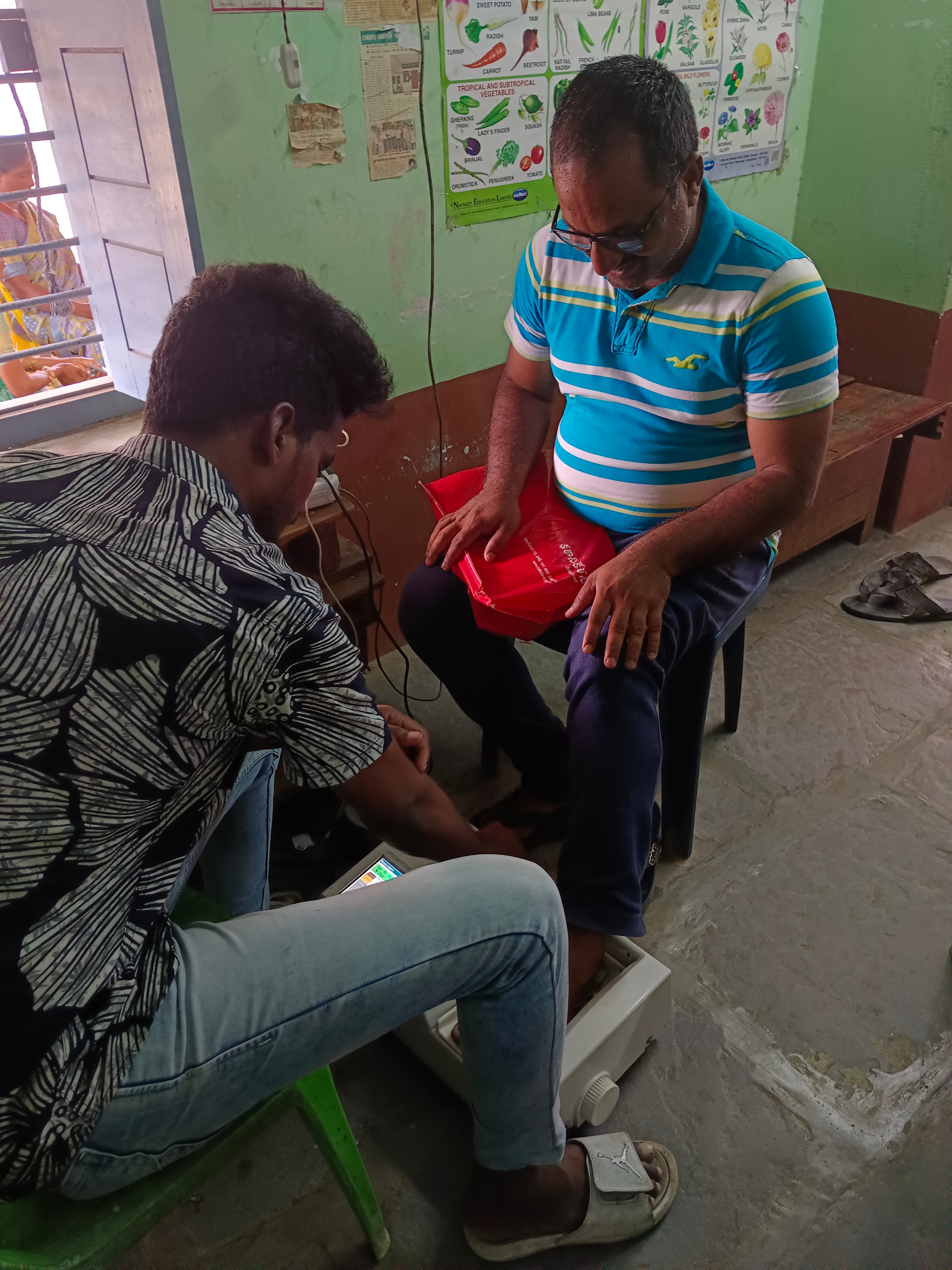 Medical professional testing orthopaedic health of a patient via foot examination.