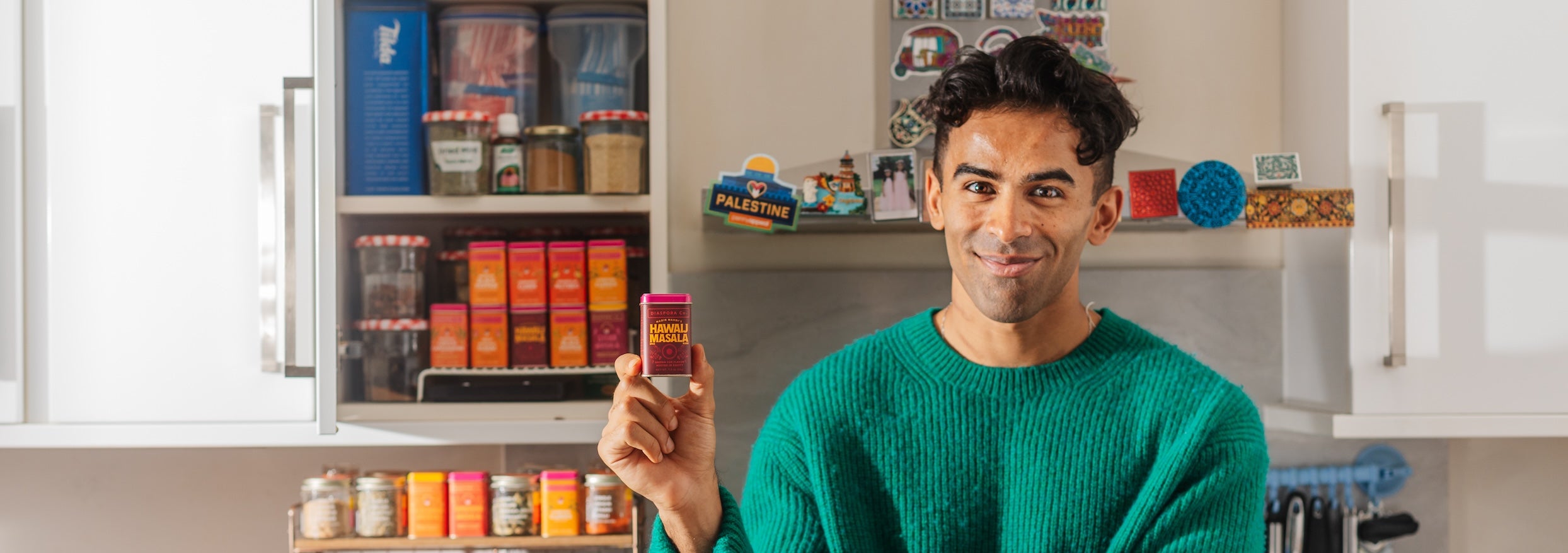 Nadir Nahdi holding a tin of Hawaij Masala