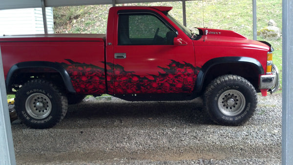 skull wave vinyl wrap on red chevy truck