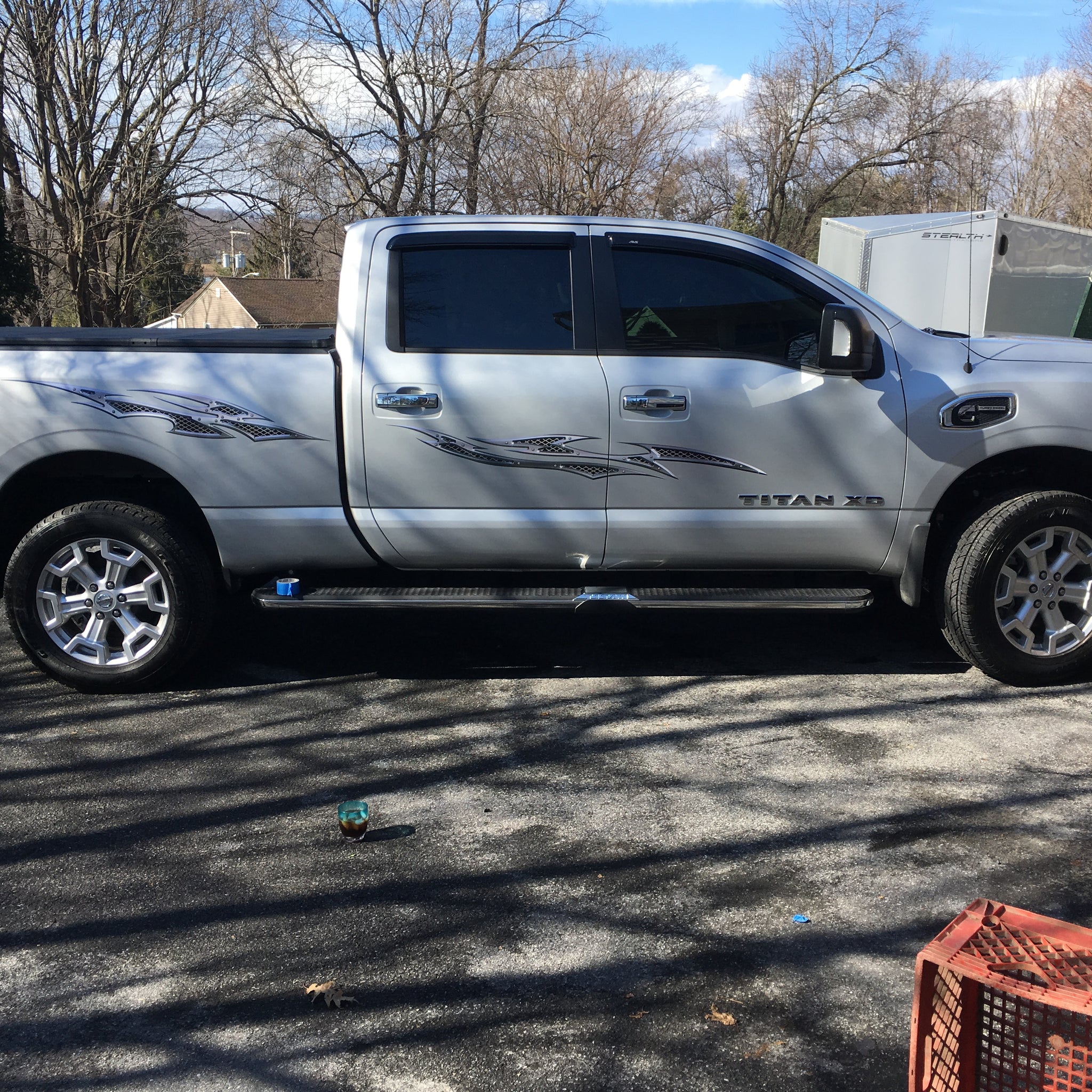 Chrome Grill Decals on side of silver Titan Truck