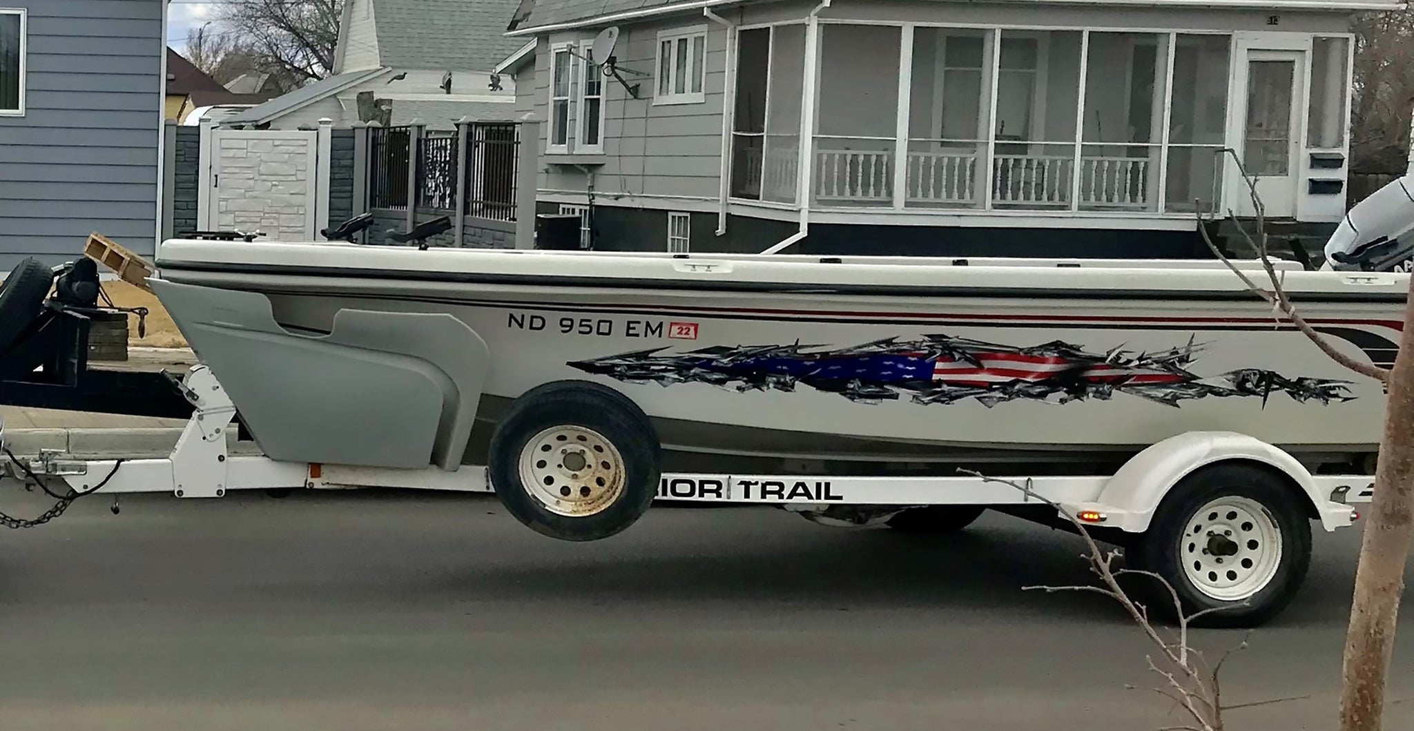 american flag tear vinyl graphics on side of boat