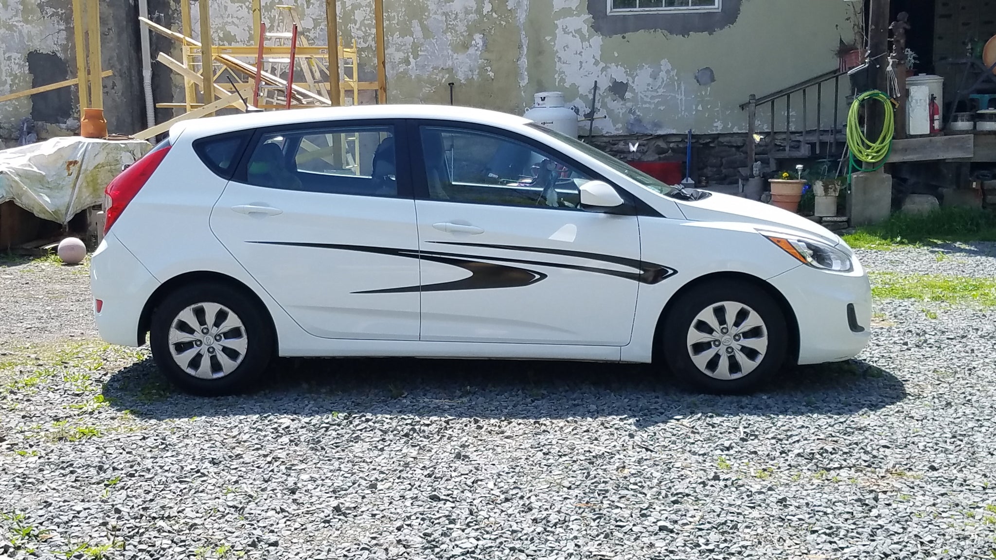 black vinyl decal stripes on white hatchback car