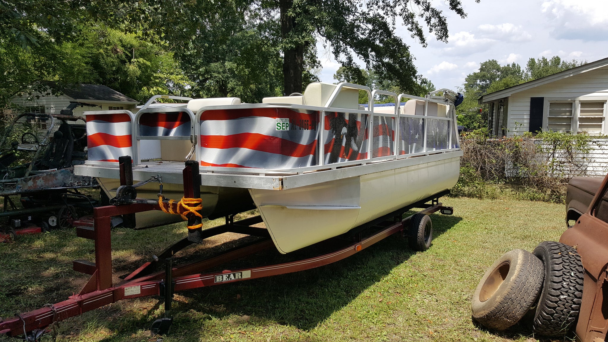 patriotic graphic wrap on pantoon boat