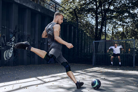 Man playing football in a GenuTrain knee brace