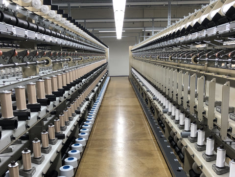 Bauerfeind Knitting facilities. Multi-level shelves stretching as far as the eye can see, holding yards of yarn