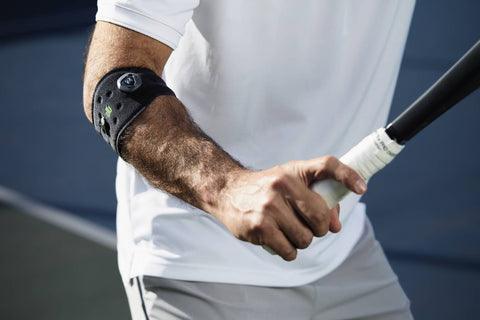 Man wearing Bauerfeind's Sports Elbow Strap, a good elbow support for helping to avoid tennis elbow. 