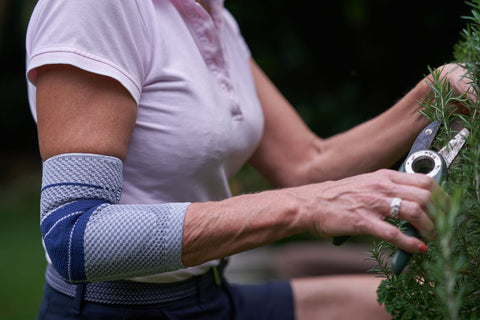 Woman gardening in the EpiTrain Elbow brace to avoid elbow pain