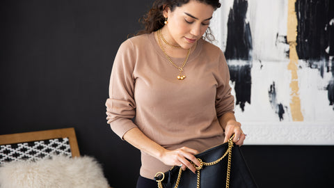 Model Carrying Lux Leather Bag and wearing Bamboo Clothes, South Sea Pearl Necklace & Earrings.