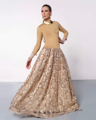 Woman in gold ballroom gown