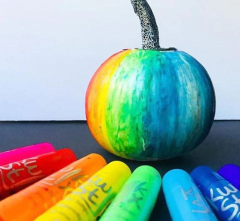 pumpkin painted in a rainbow with Kwik Stix solid tempera paint