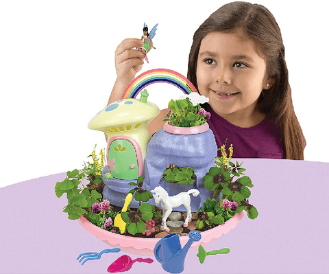 a little girl plays with her My Fairy Garden Light Unicorn Paradise play set