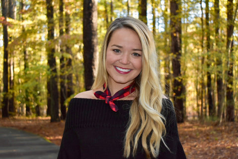 Girl wearing plaid knotted headband around neck