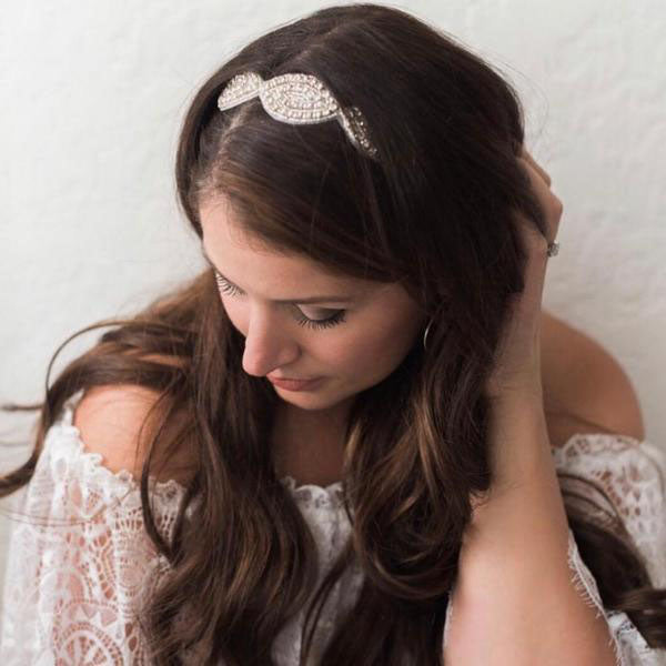 a woman wearing a peek-a-boo headband with her hair down