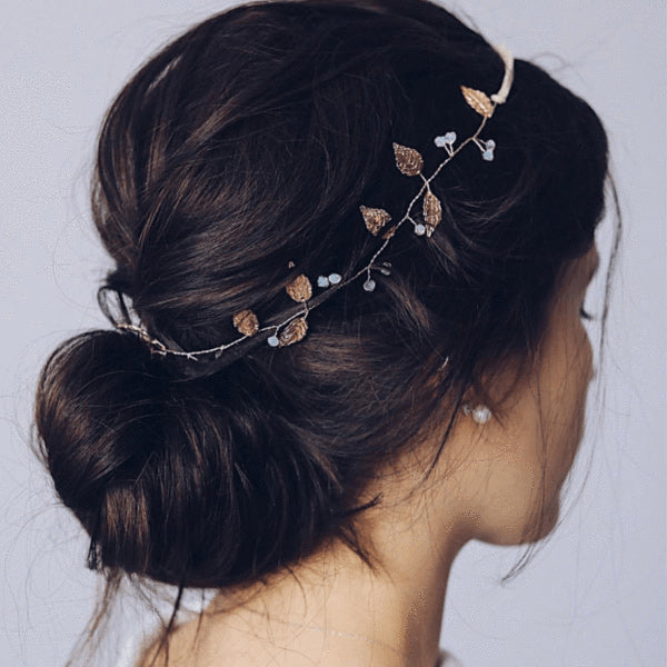 a woman sporting a delicate rose leaf headband