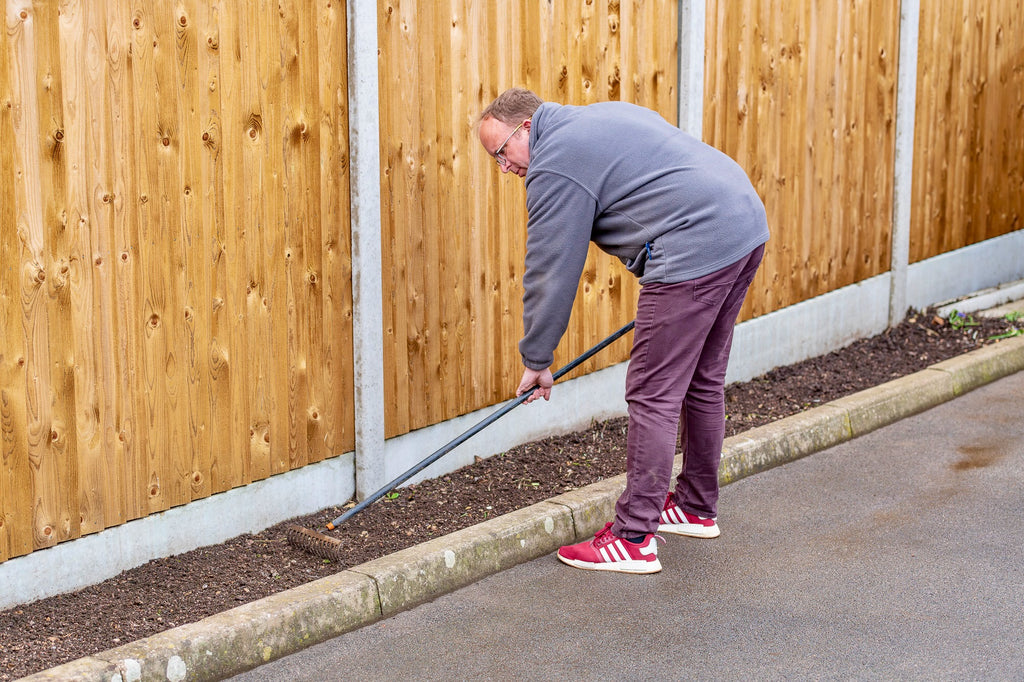 Raking in prepartion for weed mat