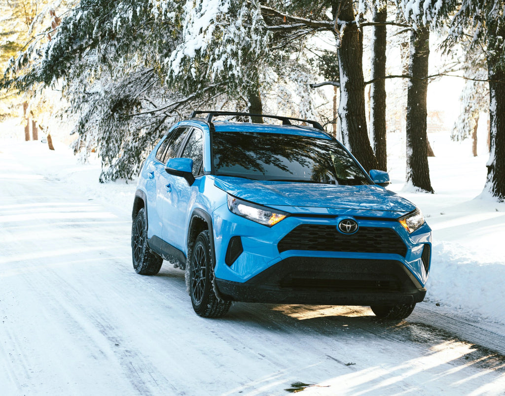 Bright Blue Rav4 in the snow