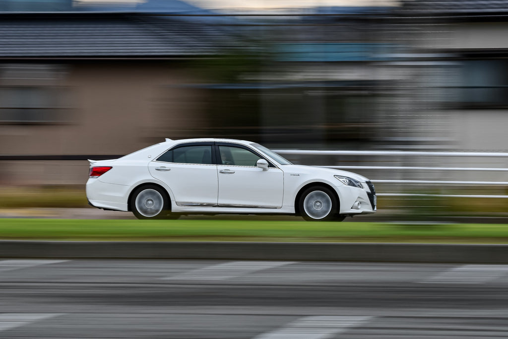 White Toyota Camry speeding right