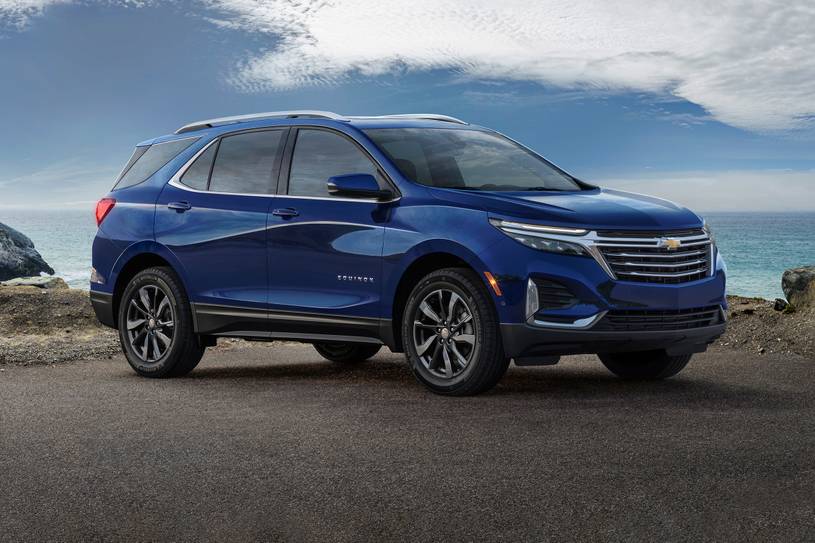 Blue Chevy Equinox in front of mountains