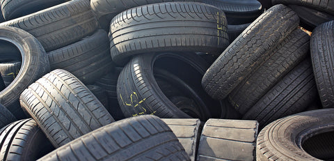 pile of used and damaged tires