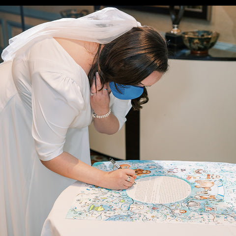 Allison signing her ketubah