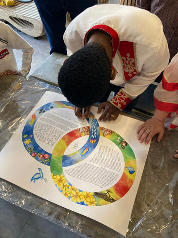 Alex signing his ketubah