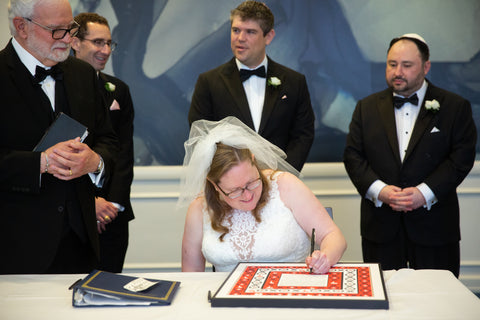 Marcie signing ketubah