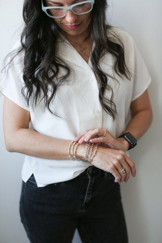 Trisha Flangan wearing her Morse Code Bracelet Collection