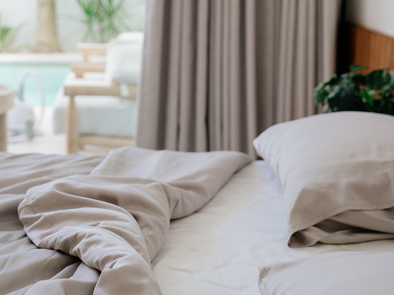 Tencel lyocell sheets in bali villa setting by oak and sand