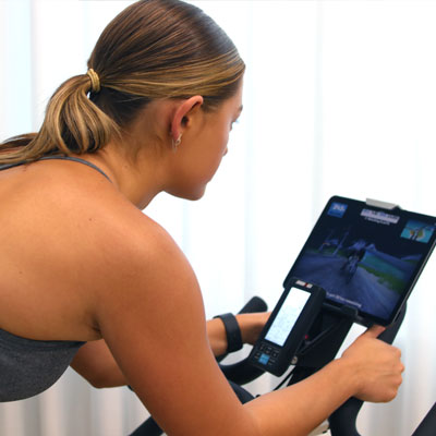 Photo of a woman riding a 1260sc Studio Cycle