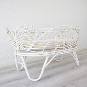 white wicker bassinet